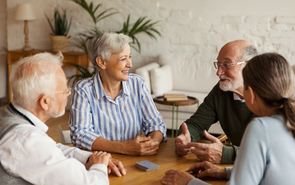 Senior Citizens talking happily in nursing home